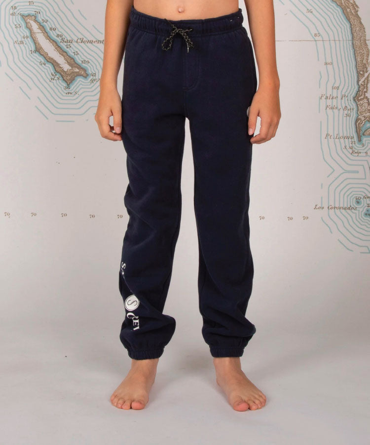 A pair of navy-colored boy's sweatpants with a custom Salty Crew drawcord and a single back pocket with snap closure.