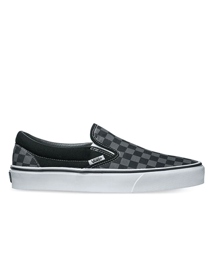 Vans Classic Slip-On shoes with black and white checkerboard pattern on the upper, white elastic side accents, and a white rubber waffle outsole.