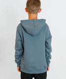 Boy wearing blue volcom hoodie showing it from the back.
