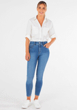Zoomed out view of the betty basics heston shirt in white vanilla. Showing how you can style it with a model wearing the shirt matched with jeans.