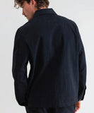 Back view of the men's Rhythm Classic Chore Coat displaying the clean straight hem and relaxed workwear fit.