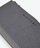 Close up of Rip Curl decal on black wallet