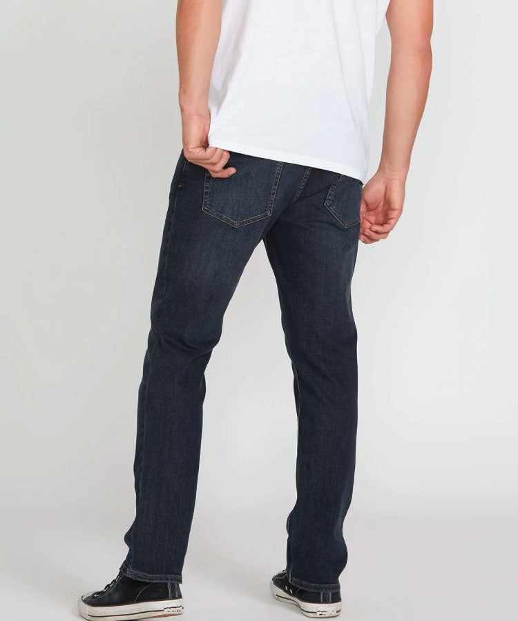 Back view of the Volcom Vorta Denim Slim Fit Jeans style A1912302 in Vintage Blue showing the asymmetric yoke line.
