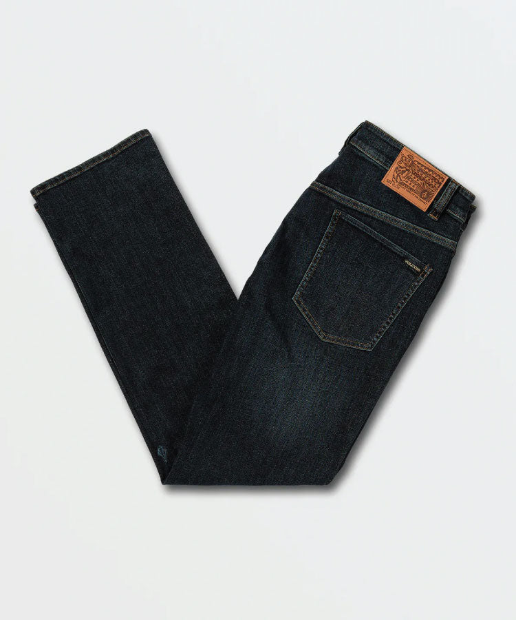 Close up detail of the premium Vintage Blue denim wash, metal rivets, durable stitching, and Volcom branded hardware.