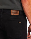Close up showing the embroidery and logo for the volcom vorta jeans black out stone.